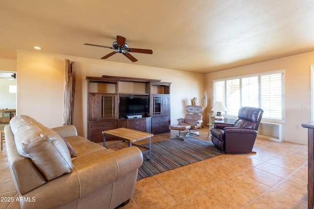 living room featuring light tile patterned flooring, a ceiling fan, and recessed lighting