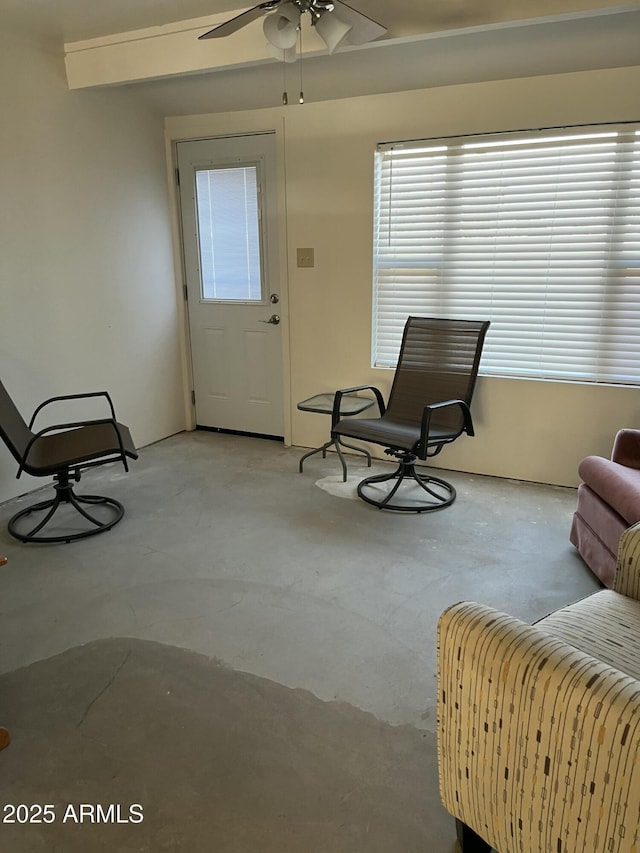 living area featuring ceiling fan