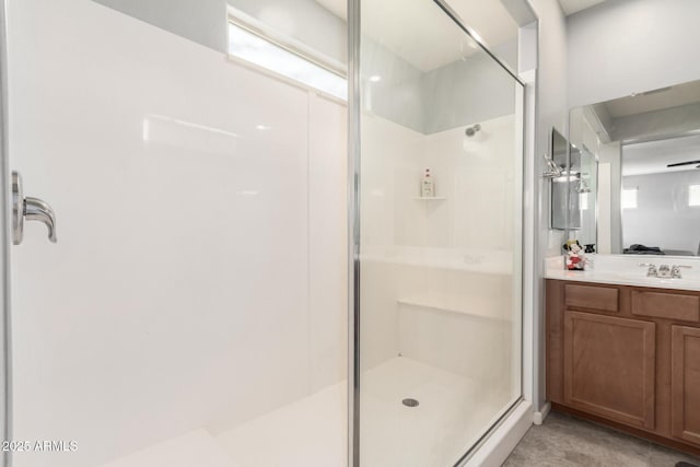 bathroom with vanity and a shower stall