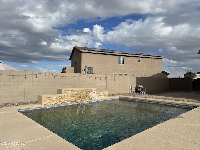 view of swimming pool with a fenced in pool and a fenced backyard