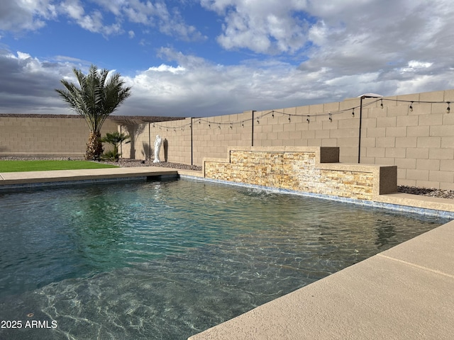 view of swimming pool featuring a fenced in pool and a fenced backyard