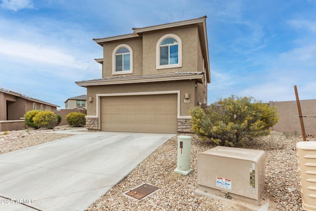 view of front facade featuring stucco siding, stone siding, and concrete driveway