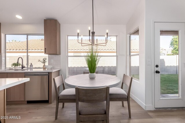 1627 W Maplewood St, Chandler, AZ 85286 - dining room with a chandelier, light wood-style floors, plenty of natural light, and baseboards