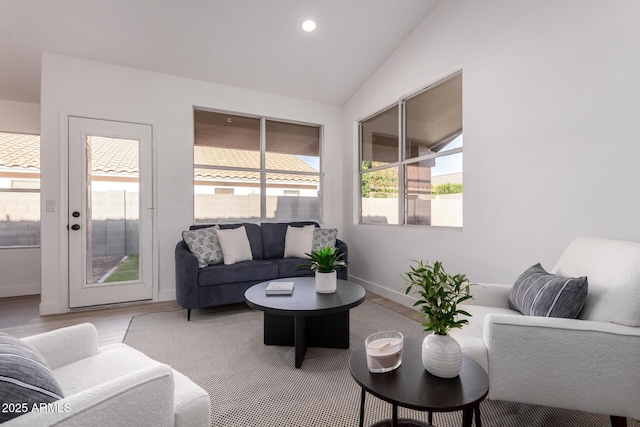 1627 W Maplewood St, Chandler, AZ 85286 - living room with light wood-type flooring, baseboards, vaulted ceiling, and recessed lighting