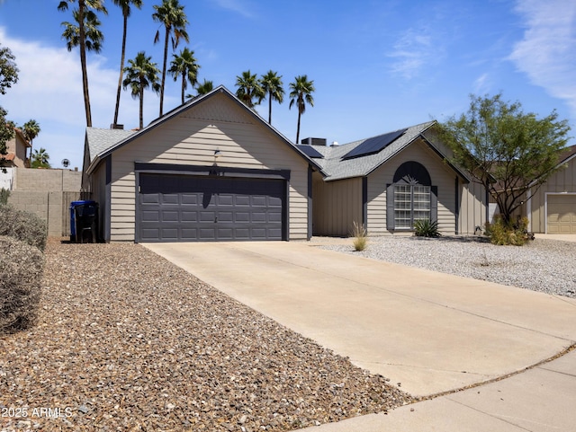 4632 E Kachina Trl, Phoenix, AZ 85044 - ranch-style home with a garage, driveway, solar panels, and roof with shingles