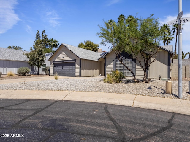 4632 E Kachina Trl, Phoenix, AZ 85044 - ranch-style house featuring driveway, roof mounted solar panels, and an attached garage