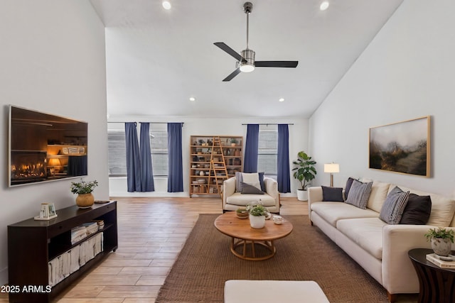 4632 E Kachina Trl, Phoenix, AZ 85044 - living room featuring ceiling fan, recessed lighting, light wood finished floors, and high vaulted ceiling