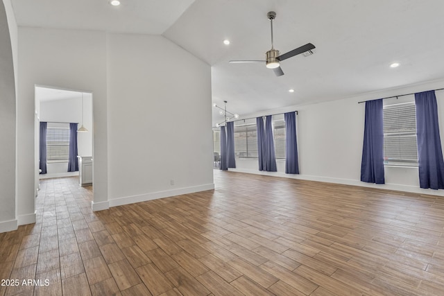 4632 E Kachina Trl, Phoenix, AZ 85044 - unfurnished living room with a ceiling fan, wood finished floors, baseboards, recessed lighting, and high vaulted ceiling