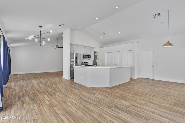 4632 E Kachina Trl, Phoenix, AZ 85044 - kitchen featuring appliances with stainless steel finishes, open floor plan, a sink, baseboards, and light countertops