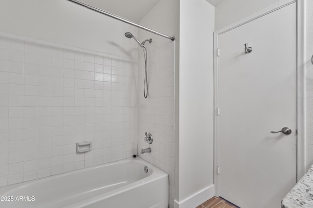4632 E Kachina Trl, Phoenix, AZ 85044 - full bathroom featuring wood finished floors, bathing tub / shower combination, and baseboards