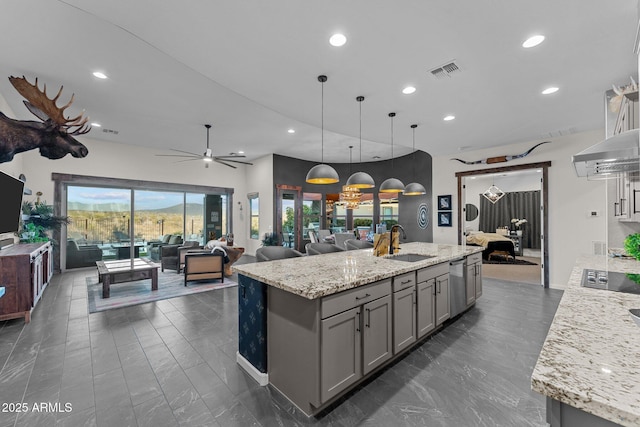 kitchen featuring recessed lighting, a sink, visible vents, open floor plan, and gray cabinets