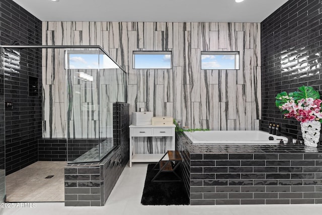 bathroom with a garden tub, vanity, walk in shower, and tile patterned floors