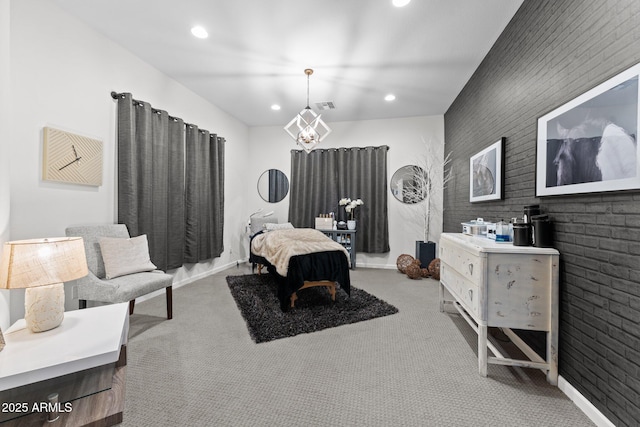 carpeted bedroom featuring baseboards, an accent wall, visible vents, and recessed lighting