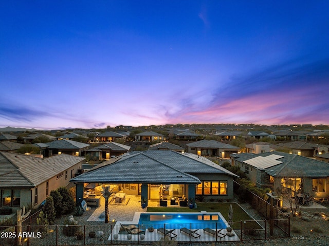 exterior space with a fenced in pool, a patio, outdoor lounge area, a residential view, and a fenced backyard