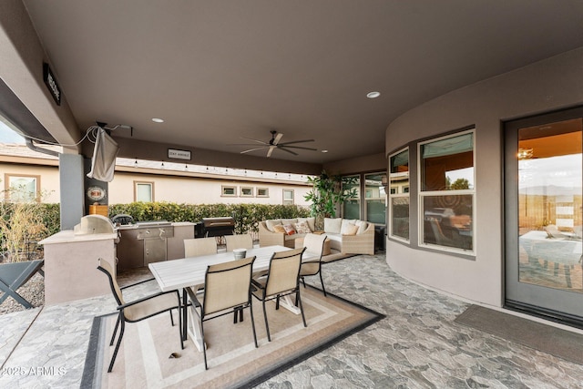 view of patio / terrace with an outdoor kitchen, ceiling fan, a grill, outdoor dining area, and outdoor lounge area