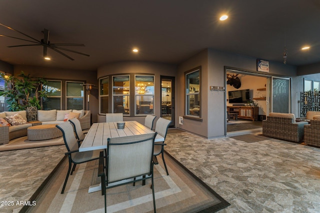 view of patio / terrace with ceiling fan, outdoor dining space, and outdoor lounge area