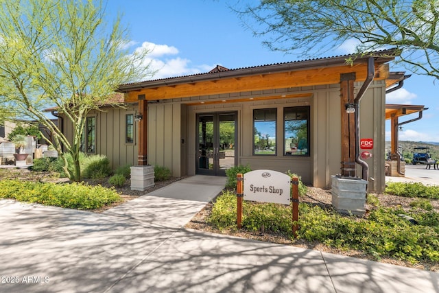 3254 Buckaroo Ct, Wickenburg, AZ 85390 - view of exterior entry featuring board and batten siding and french doors
