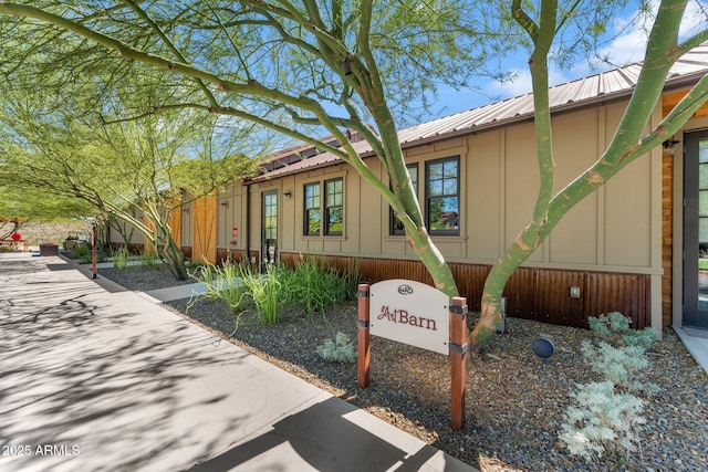 3254 Buckaroo Ct, Wickenburg, AZ 85390 - view of front of home with board and batten siding and metal roof