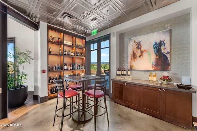 3254 Buckaroo Ct, Wickenburg, AZ 85390 - dining room featuring an ornate ceiling, french doors, and a dry bar