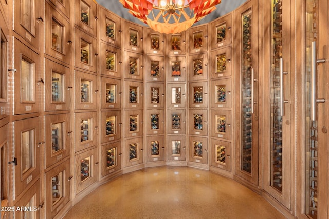 3254 Buckaroo Ct, Wickenburg, AZ 85390 - wine room with an inviting chandelier and light speckled floor