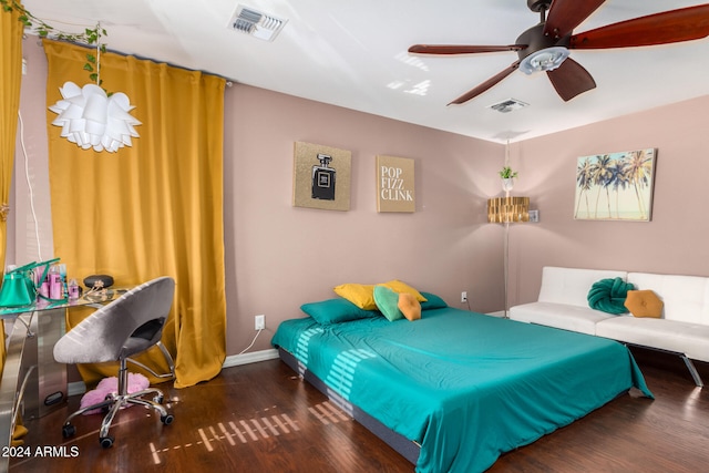 bedroom featuring ceiling fan and dark hardwood / wood-style flooring