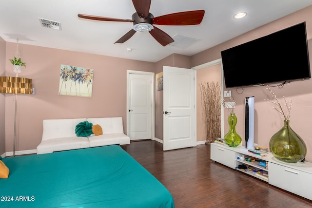 bedroom with dark hardwood / wood-style floors and ceiling fan