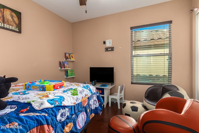 bedroom with ceiling fan and hardwood / wood-style floors