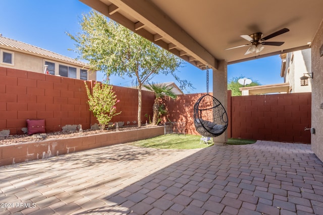 view of patio featuring ceiling fan