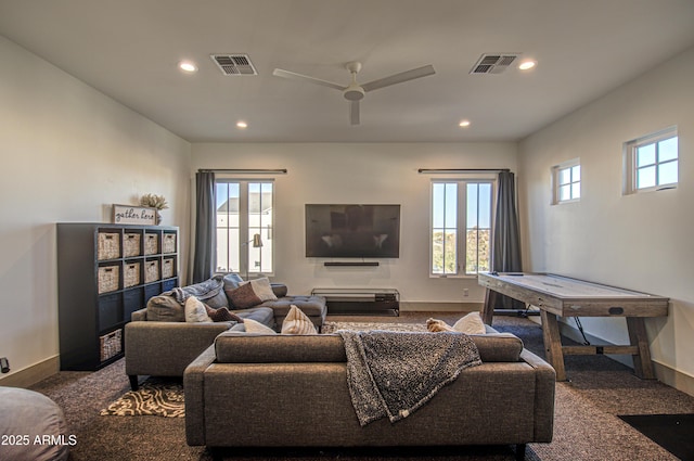 living room with carpet and ceiling fan