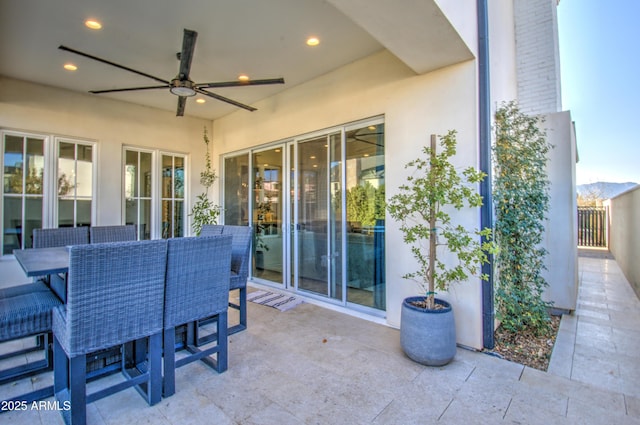 view of patio featuring ceiling fan