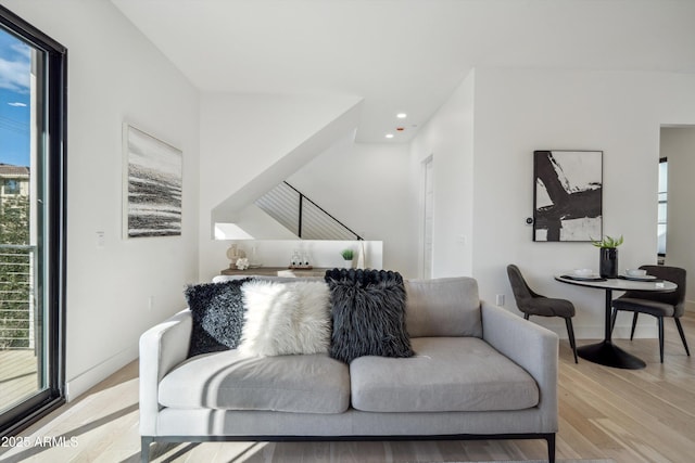 living room with light hardwood / wood-style flooring