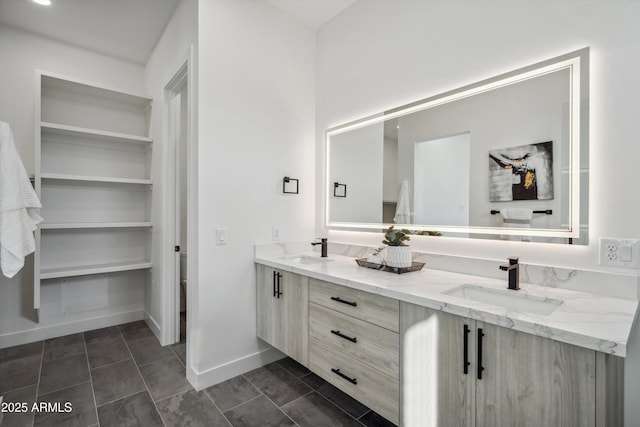 bathroom with tile patterned flooring and vanity