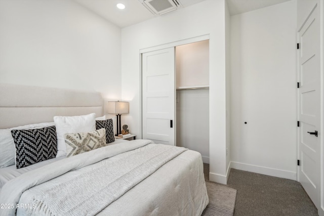 bedroom with carpet and a closet