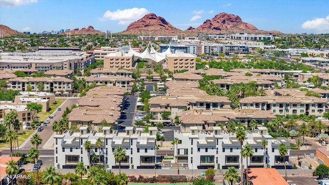 birds eye view of property with a mountain view