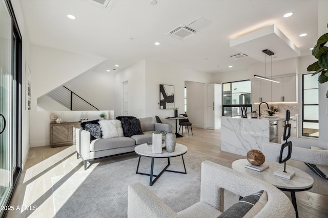 living room with light hardwood / wood-style floors