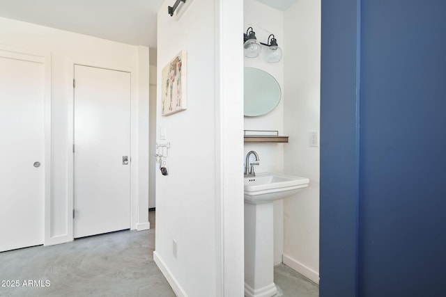 bathroom with concrete floors