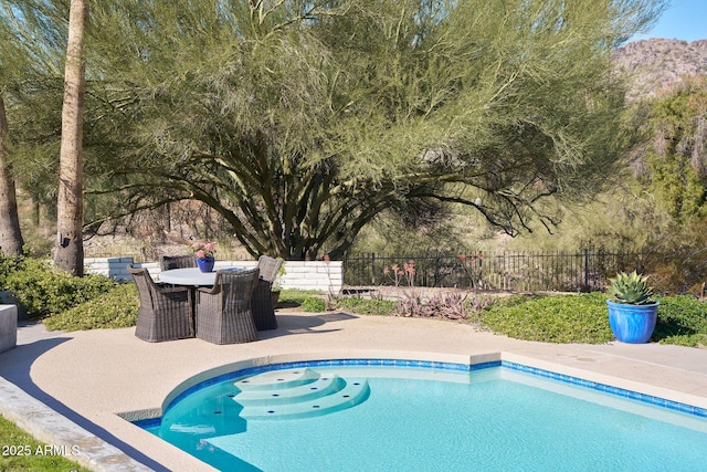 view of swimming pool featuring a patio