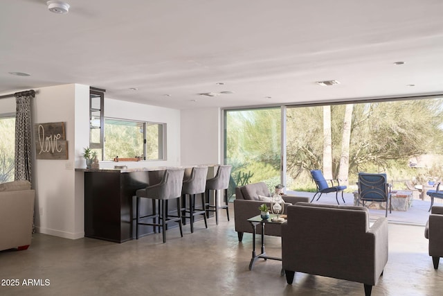 living room featuring concrete floors