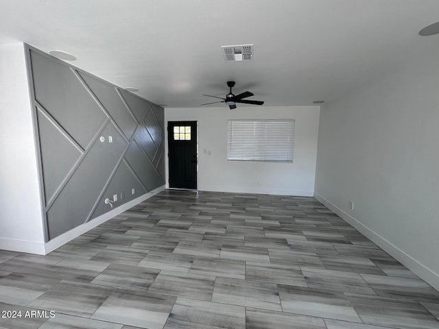 entrance foyer with ceiling fan