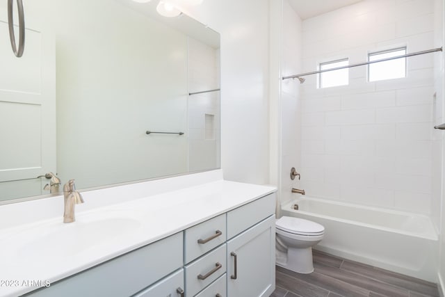 full bathroom with vanity,  shower combination, and toilet