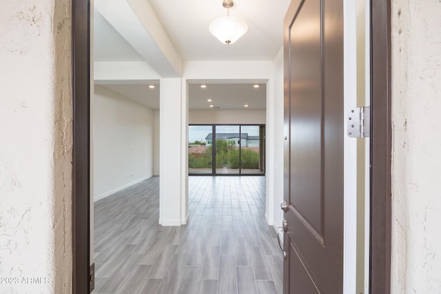 hall with light hardwood / wood-style floors