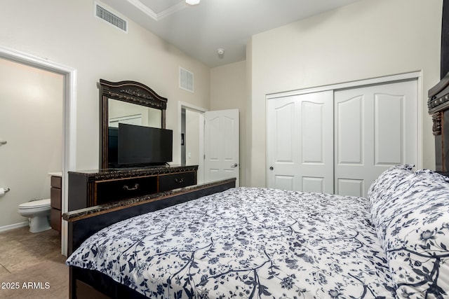 bedroom with connected bathroom and a closet