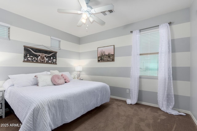 bedroom featuring dark colored carpet and ceiling fan