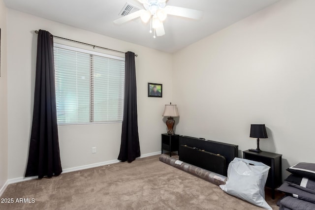 interior space with ceiling fan