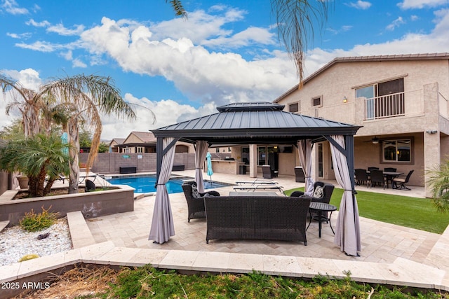 view of swimming pool with an outdoor living space, a gazebo, and a patio