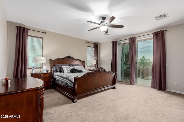 bedroom with multiple windows, access to outside, light colored carpet, and ceiling fan