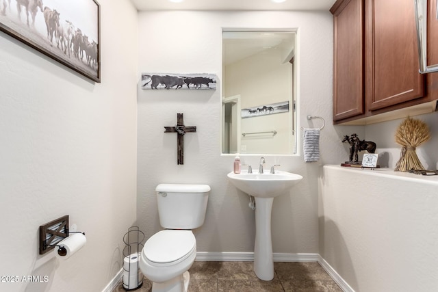 bathroom with tile patterned flooring and toilet