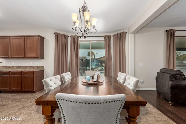 dining room featuring an inviting chandelier and light hardwood / wood-style flooring