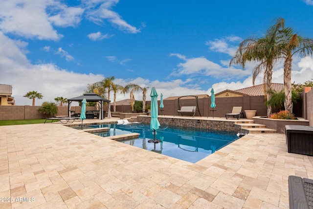 view of swimming pool featuring a gazebo, an in ground hot tub, and a patio area