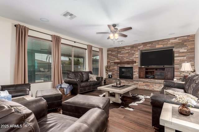 living room with hardwood / wood-style floors, a fireplace, and ceiling fan